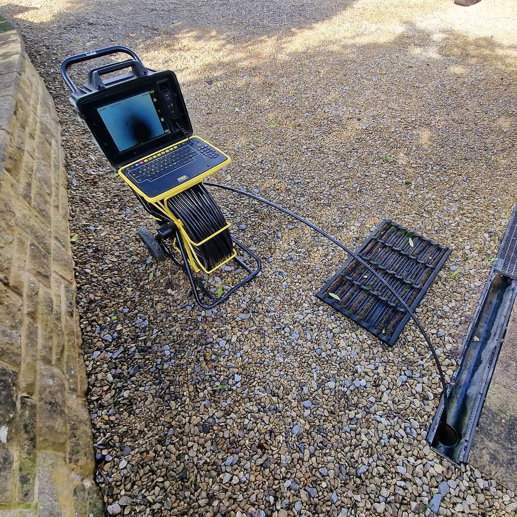 High-pressure drain survey equipment for thorough drainage system inspection in UK properties.